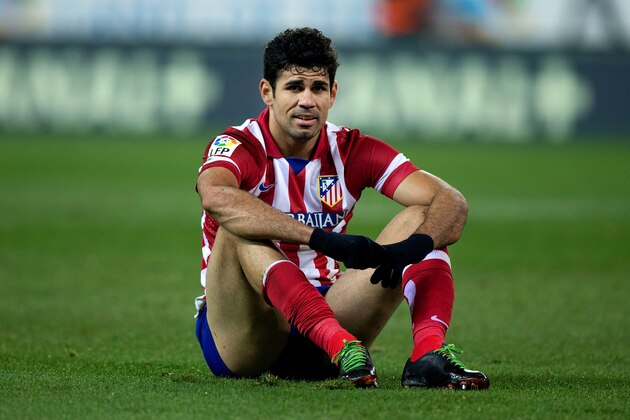 MADRID, SPAIN - JANUARY 11:  Diego Costa of Atletico de Madrid sits on the ground after failing to score during the La Liga match between Club Atletico de Madrid and FC Barcelona at Vicente Calderon Stadium on January 11, 2014 in Madrid, Spain.  (Photo by Gonzalo Arroyo Moreno/Getty Images)