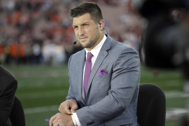 Tim Tebow on ESPN before the NCAA BCS National Championship college football game between Auburn and Florida State Monday, Jan. 6, 2014, in Pasadena, Calif. (AP Photo/David J. Phillip)