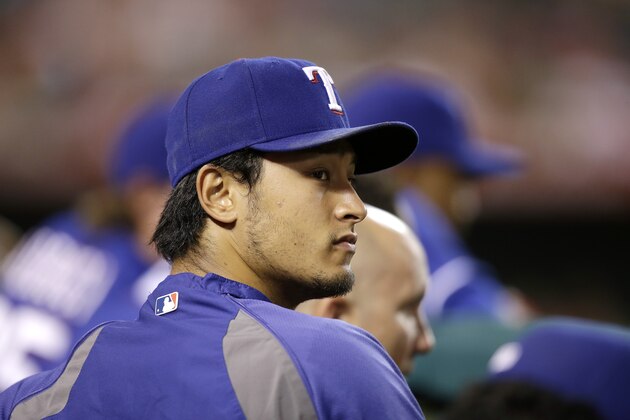 Texas Rangers starting pitcher Yu Darvish, of Japan, watches from the dugout during the third inning of a baseball game on Friday, Sept. 6, 2013, in Anaheim, Calif. (AP Photo/Jae C. Hong)