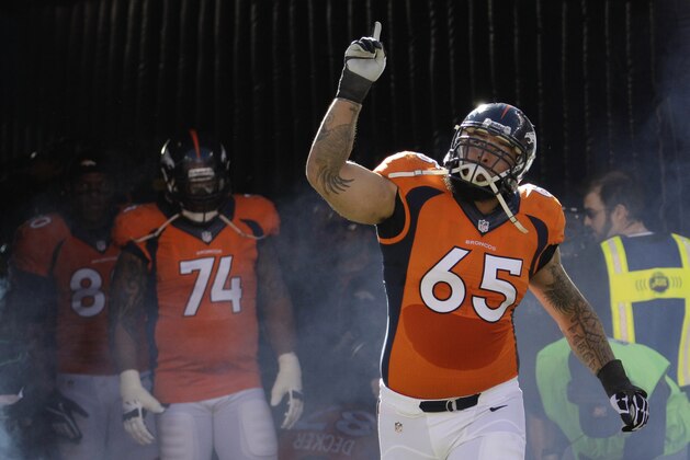 Denver Broncos guard Louis Vasquez (65) before the AFC Championship NFL playoff football against the New England Patriots game in Denver, Sunday, Jan. 19, 2014. (AP Photo/Charlie Riedel)