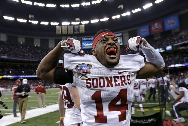 Oklahoma defensive back Aaron Colvin (14)  celebrates after a touchdown in the final minute in the second half of the NCAA college football Sugar Bowl against Alabama in New Orleans, Thursday, Jan. 2, 2014. (AP Photo/Rusty Costanza)