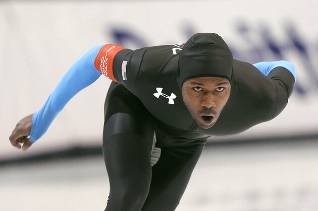 Shani Davis competes in the men's 1,500 meters, which he won, during the U.S. Olympic speedskating trials Tuesday, Dec. 31, 2013, in Kearns, Utah. (AP Photo/Rick Bowmer)