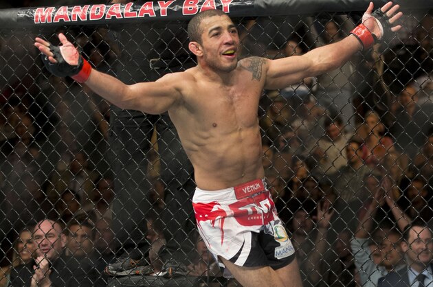 Jose Aldo, of Rio de Janeiro, celebrates his unanimous decision victory over Frankie Edgar just after their UFC 156 featherweight mixed martial arts title match, Saturday, Feb. 2, 2013 at The Mandalay Bay Resort & Casino in Las Vegas. (AP Photo/Eric Jamison)