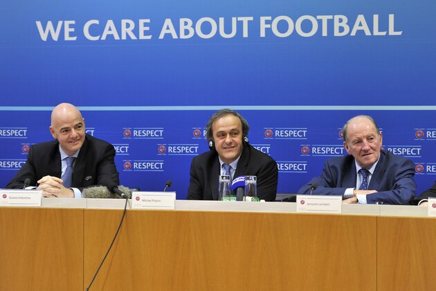 NYON, SWITZERLAND - JANUARY 24:  UEFA President Michel Platini (C) speaks as UEFA General Secretary Gianni Infantino (L) and EURO 2016 SAS Chairman Jacques Lambert (R) look on during a press conference following the UEFA Executive Committee meeting at the UEFA headquarters, The House of European Football, on January 24, 2014 in Nyon,  Switzerland.  (Photo by Harold Cunningham/Getty Images)