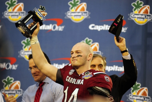 Jan 1, 2014; Orlando, FL, USA; South Carolina Gamecocks quarterback Connor Shaw (14) is named Bowl MVP as South Carolina beats Wisconsin 34-24 in the Capital One Bowl at Florida Citrus Bowl.  Mandatory Credit: David Manning-USA TODAY Sports