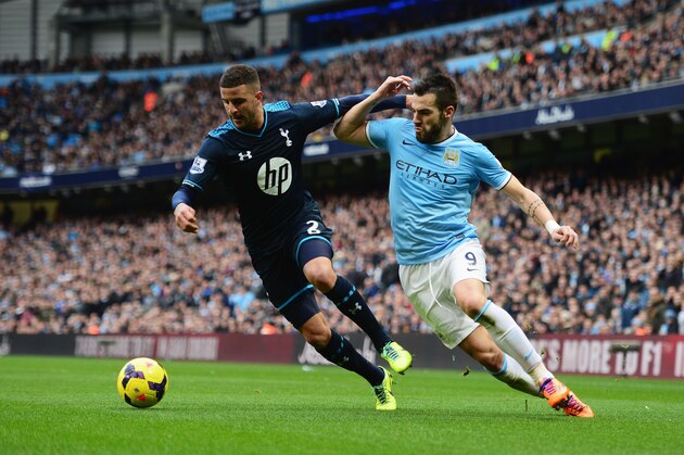 MANCHESTER, ENGLAND - NOVEMBER 24:  Alvaro Negredo of Manchester City challenges Kyle Walker of Tottenham Hotspur during the Barclays Premier League match between Manchester City and Tottenham Hotspur at Etihad Stadium on November 24, 2013 in Manchester, England.  (Photo by Jamie McDonald/Getty Images)