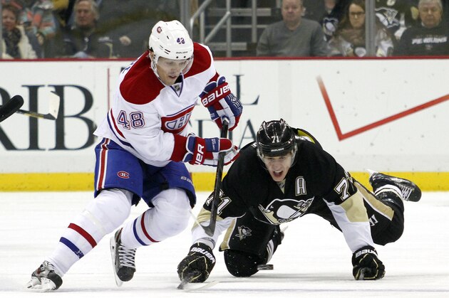 PITTSBURGH, PA - JANUARY 22:  Evgeni Malkin #71 of the Pittsburgh Penguins pokes the puck from Daniel Briere #48 of the Montreal Canadiens during the game at Consol Energy Center on January 22, 2014 in Pittsburgh, Pennsylvania.  (Photo by Justin K. Aller/Getty Images)