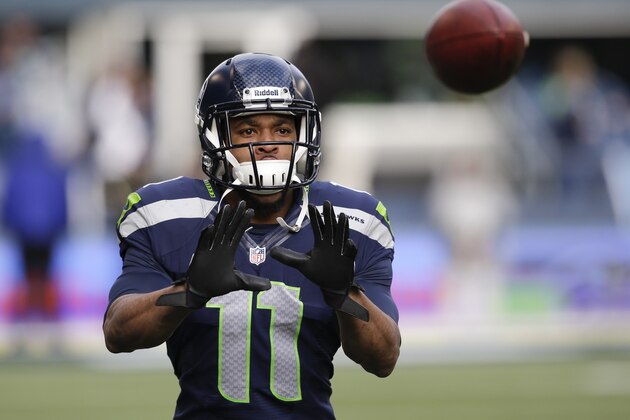 Seattle Seahawks wide receiver Percy Harvin warms up before an NFC divisional playoff NFL football game against the New Orleans Saints in Seattle, Saturday, Jan. 11, 2014. (AP Photo/Elaine Thompson)