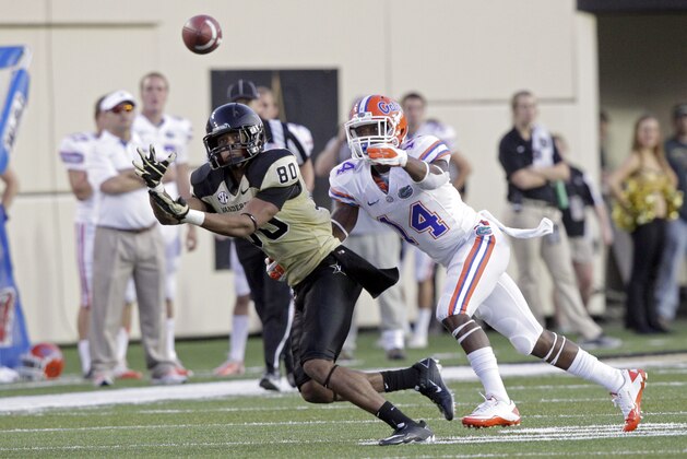 Vanderbilt wide receiver Chris Boyd (80) tries to catch the ball as he's defended by Florida defensive back Jaylen Watkins (14) in the second quarter of an NCAA college football game on Saturday, Oct. 13, 2012 in Nashville, Tenn. (AP Photo/Wade Payne)