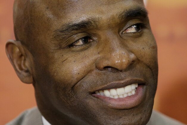 Charlie Strong smiles during a news conference where he is introduced as the new Texas football coach, Monday,  Jan. 6, 2014, in Austin, Texas. (AP Photo/Eric Gay)