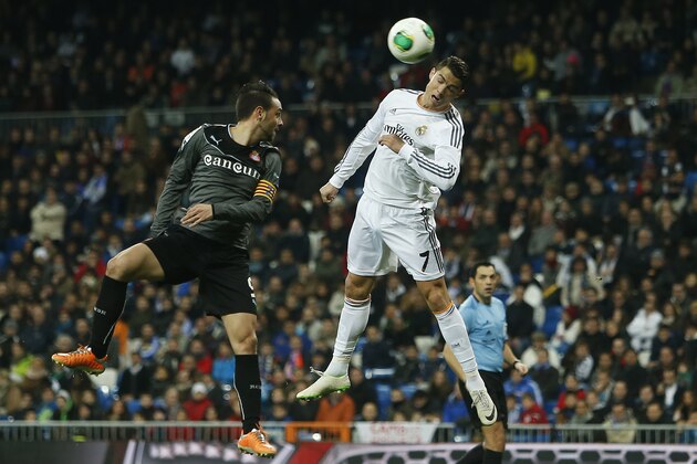 Real Madrid's Cristiano Ronaldol, right, in action with Espanyol's Sergio Garcia, left, during a Copa del Rey soccer match between Real Madrid and Espanyol at the Santiago Bernabeu stadium in Madrid, Spain, Tuesday, Jan. 28, 2014. (AP Photo/Andres Kudacki) Real Madrid's Cristiano Ronaldol, right, in action with Espanyol's Sergio Garcia, left, during a Copa del Rey soccer match between Real Madrid and Espanyol at the Santiago Bernabeu stadium in Madrid, Spain, Tuesday, Jan. 28, 2014. (AP Photo/Andres Kudacki)