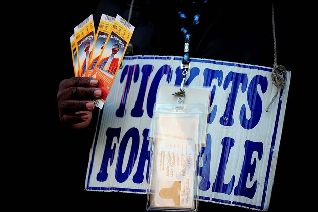 Feb 5, 2012; Indianapolis, IN, USA; A ticket scalper sells tickets outside of Super Bowl Village before Super Bowl XLVI between the New England Patriots and the New York Giants. Mandatory Credit: Andrew Weber-USA TODAY Sports