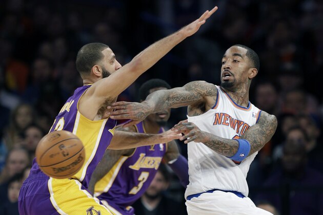 New York Knicks' J.R. Smith, right, passes around Los Angeles Lakers' Kendall Marshall during the second half of an NBA basketball game at Madison Square Garden, Sunday, Jan. 26, 2014, in New York. The Knicks defeated the Lakers 110-103. (AP Photo/Seth Wenig) New York Knicks' J.R. Smith, right, passes around Los Angeles Lakers' Kendall Marshall during the second half of an NBA basketball game at Madison Square Garden, Sunday, Jan. 26, 2014, in New York. The Knicks defeated the Lakers 110-103. (AP Photo/Seth Wenig)
