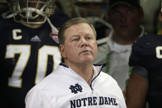 FILE - Notre Dame head coach Brian Kelly watches play against Alabama during the second half of the BCS National Championship college football game in this Jan. 7, 2013 file photo taken in Miami. The Philadelphia Eagles interviewed Notre Dame coach Brian Kelly Tuesday Jan 8, 2013 for their coaching vacancy, a person familiar with the meeting told The Associated Press.  (AP Photo/Chris O'Meara)