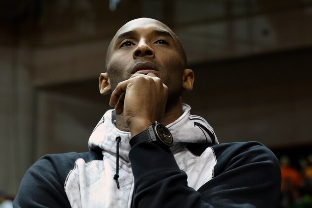 Jan 22, 2014; Coral Gables, FL, USA; Los Angeles Lakers shooting guard Kobe Bryant watches the game between the Duke Blue Devils Miami Hurricanes in the first half at BankUnited Center. Mandatory Credit: Robert Mayer-USA TODAY Sports