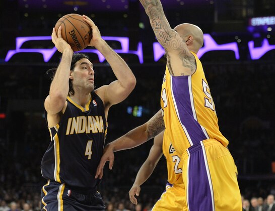 Jan 28, 2014; Los Angeles, CA, USA; Los Angeles Lakers center Robert Sacre (50) defends against Indiana Pacers power forward Luis Scola (4) during the second half at Staples Center. Mandatory Credit: Richard Mackson-USA TODAY Sports