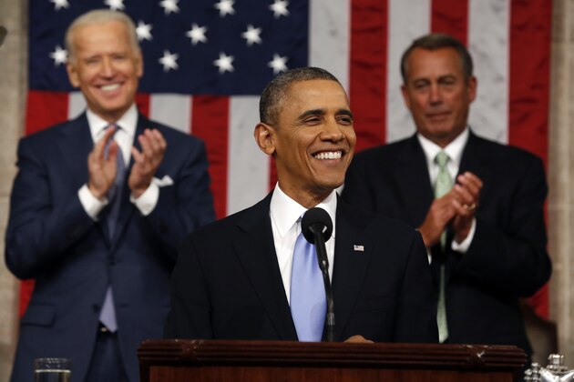 President Barack Obama delivers the State of Union address before a joint session of Congress in the House chamber Tuesday, Jan. 28, 2014, in Washington, as Vice President Joe Biden, and House Speaker John Boehner of Ohio, applaud. (AP Photo/Larry Downing, Pool)