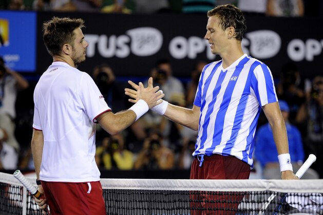 Stanislas Wawrinka of Switzerland, left,  shakes hands with Tomas Berdych of the Czech Republic at the net after Wawrinka won their semifinal at the Australian Open tennis championship in Melbourne, Australia, Thursday, Jan. 23, 2014.(AP Photo/Andrew Brownbill)