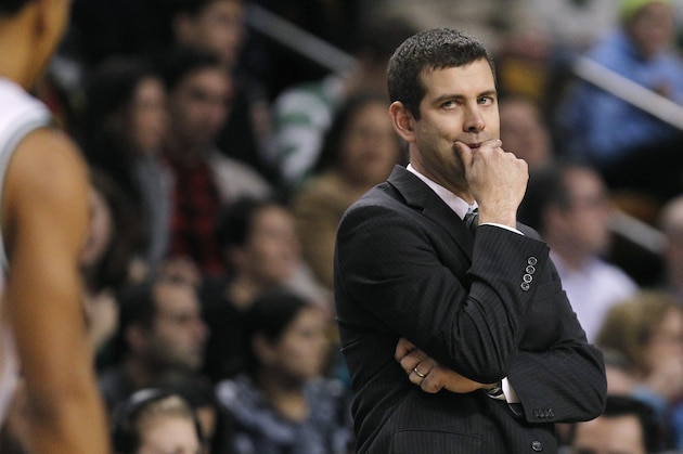 Boston Celtics head coach Brad Stevens looks toward his players during the second half of an NBA basketball game against the Los Angeles Lakers in Boston, Friday, Jan. 17, 2014.  The Lakers defeated the Celtics 107-104. (AP Photo/Charles Krupa)
