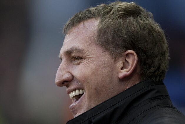 Liverpool's manager Brendan Rodgers smiles before his team's 5-3 win against Stoke in their English Premier League soccer match at the Britannia Stadium, Stoke, England, Sunday Jan 12, 2014. (AP Photo/Jon Super)