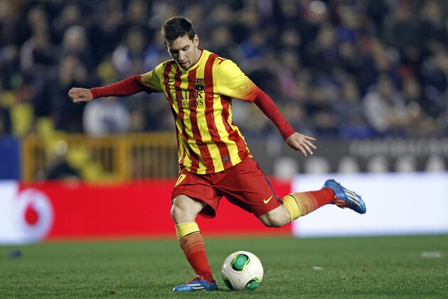 Barcelona's  Lionel Messi from Argentina shoots the ball during their la Copa del Rey soccer match against Levante at the Ciutat de Valencia stadium in Valencia, Spain, Wednesday Jan. 22, 2014. The Argentinean plays his 400th game in a Barcelona shirt in the Copa del Rey against Levante. (AP Photo/Alberto Saiz)