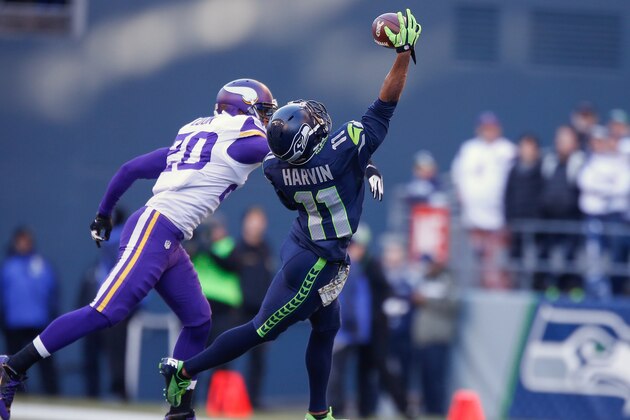 SEATTLE, WA - NOVEMBER 17:  Wide receiver Percy Harvin #11 of the Seattle Seahawks makes a catch against cornerback Chris Cook #20 of the Minnesota Vikings at CenturyLink Field on November 17, 2013 in Seattle, Washington.  (Photo by Otto Greule Jr/Getty Images)