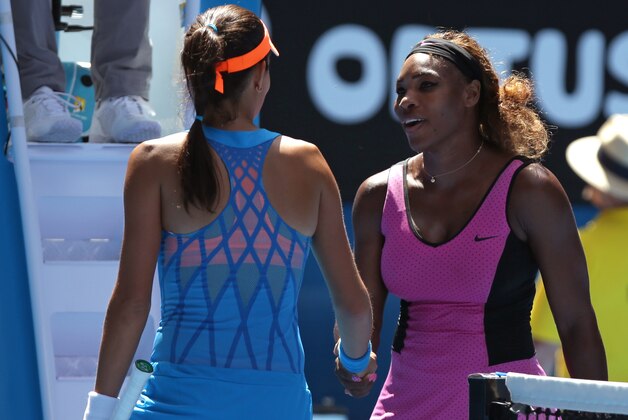 Ana Ivanovic of Serbia, left, is congratulated by Serena Williams of the U.S. after Ivanovic's fourth round win at the Australian Open tennis championship in Melbourne, Australia, Sunday, Jan. 19, 2014.(AP Photo/Aaron Favila)
