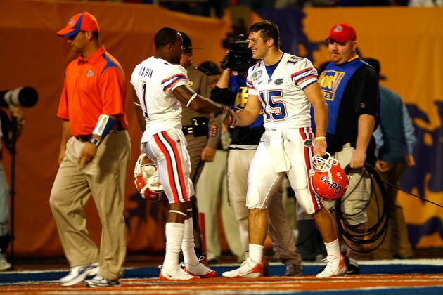 MIAMI - JANUARY 08:  (L-R) Percy Harvin and Tim Tebow of the Florida Gators greet each other in the end zone during warm-ups against the Oklahoma Sooners prior to the start of the FedEx BCS National Championship game at Dolphin Stadium on January 8, 2009 in Miami, Florida.  (Photo by Marc Serota/Getty Images)