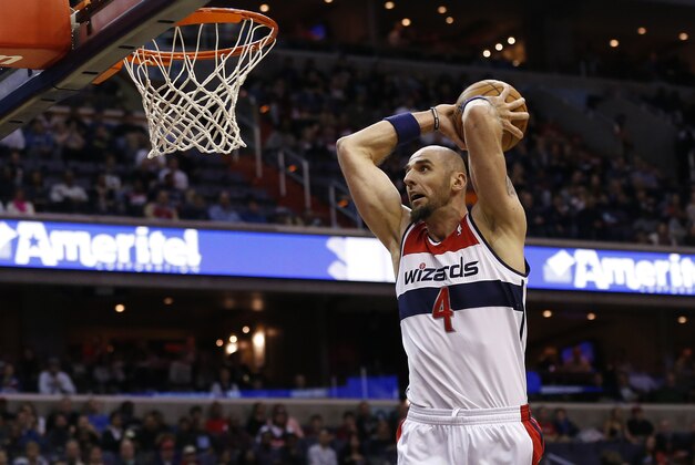 Jan 15, 2014; Washington, DC, USA; Washington Wizards center Marcin Gortat (4) dunks the ball against the Miami Heat in the first quarter at Verizon Center. Mandatory Credit: Geoff Burke-USA TODAY Sports