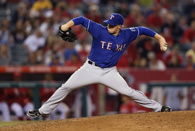 ANAHEIM, CA - AUGUST 07:  Robbie Ross #46 of the Texas Rangers pitches against the Los Angeles Angels of Anaheim at Angel Stadium of Anaheim on August 7, 2013 in Anaheim, California.  (Photo by Jeff Gross/Getty Images)