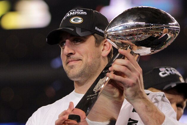 ARLINGTON, TX - FEBRUARY 06:  MVP Aaron Rodgers #12 of the Green Bay Packers holds up The Vince Lombardi Trophy after the Green Bay Packers defeated the Pittsburgh Steelers 31 to 25 in Super Bowl XLV at Cowboys Stadium on February 6, 2011 in Arlington, Texas.  (Photo by Doug Pensinger/Getty Images)