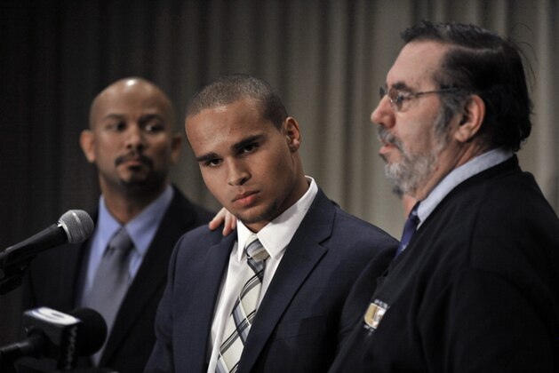 Northwestern quarterback Kain Colter center, and College Athletes Players Association president Ramogi Huma, left, listen while United Steelworkers president Leo Gerard speaks during a news conference in Chicago on Tuesday, Jan. 28, 2014. Calling the NCAA a dictatorship, Colter and the Steelworkers announced plans Tuesday to form the first labor union for college athletes--the latest salvo in the bruising fight over whether amateur players should be paid. (AP Photo/Paul Beaty) Northwestern quarterback Kain Colter center, and College Athletes Players Association president Ramogi Huma, left, listen while United Steelworkers president Leo Gerard speaks during a news conference in Chicago on Tuesday, Jan. 28, 2014. Calling the NCAA a dictatorship, Colter and the Steelworkers announced plans Tuesday to form the first labor union for college athletes--the latest salvo in the bruising fight over whether amateur players should be paid. (AP Photo/Paul Beaty)