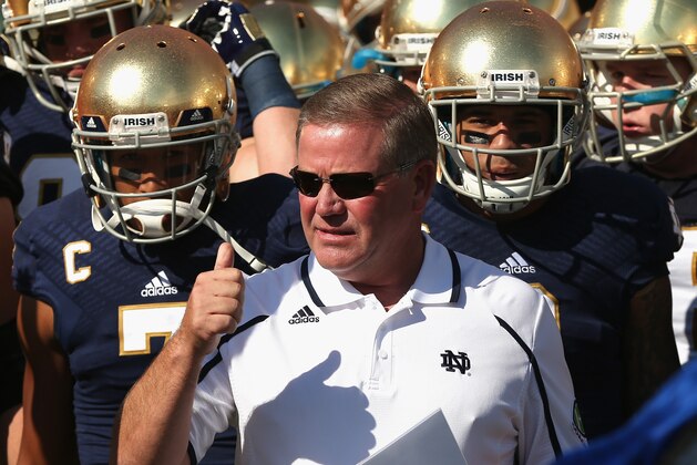 SOUTH BEND, IN - SEPTEMBER 28:  Head coach Brian Kelly of the Notre Dame Fighting Irish waits torun onto the field with his team before a game against the Oklahoma Sooners at Notre Dame Stadium on September 28, 2013 in South Bend, Indiana. Oklahoma defeated Notre Dame 35-21.  (Photo by Jonathan Daniel/Getty Images)