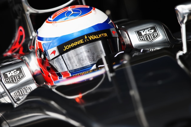 JEREZ DE LA FRONTERA, SPAIN - JANUARY 29:  Jenson Button of Great Britain and McLaren exits his team garage to drive the new MP4-29 during day two of Formula One Winter Testing at the Circuito de Jerez on January 29, 2014 in Jerez de la Frontera, Spain.  (Photo by Mark Thompson/Getty Images)
