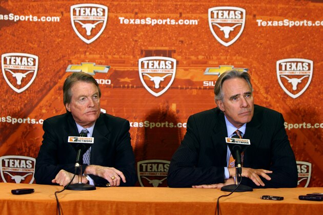 AUSTIN, TX - DECEMBER 15: University of Texas at Austin president Bill Powers, left, and Athletic Director Steve Patterson answer questions regarding the resignation of football coach Mack Brown on December 15, 2013 in Austin, Texas. Moments earlier, Brown announced he will step down as coach after the Valero Alamo Bowl game against Oregon on December 30. (Photo by Erich Schlegel/Getty Images)