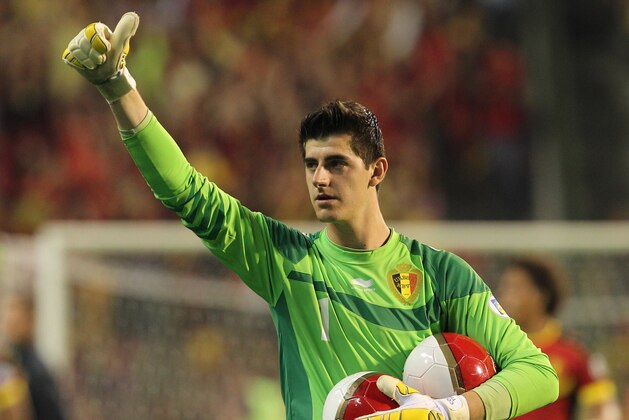 Belgium's goalkeeper Thibaut Courtois gestures, after Belgium won 2-1 against Serbia, during their World Cup 2014 Group A qualifying soccer match at the King Baudouin stadium in Brussels, Friday, June 7, 2013. (AP Photo/Yves Logghe)