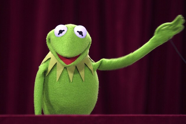 Kermit the frog waves to audience during the premier of the Muppet Movie in Sydney, Australia, Wednesday, Dec. 21, 2011. (AP Photo/Rob Griffith)