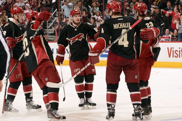 GLENDALE, AZ - JANUARY 28:  Oliver Ekman-Larsson #23 of the Phoenix Coyotes celebrates with teammates Lauri Korpikoski #28, Antoine Vermette #50, Mikkel Boedker #89 and Zbynek Michalek #4 after his first-period goal against the Los Angeles Kings at Jobing.com Arena on January 28, 2014 in Glendale, Arizona.  (Photo by Norm Hall/NHLI via Getty Images)