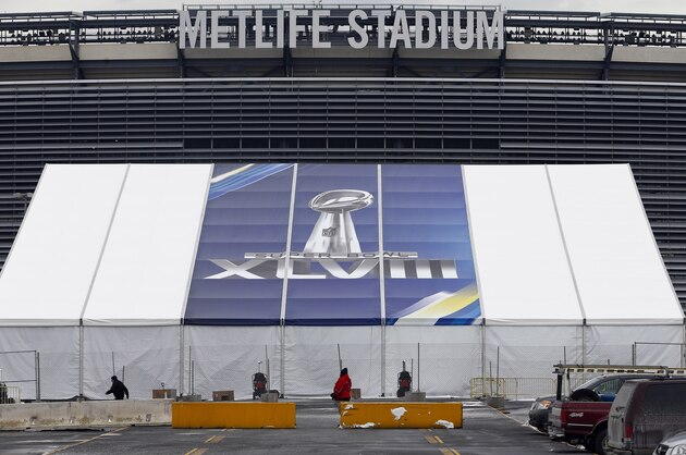EAST RUTHERFORD, NJ - JANUARY 27:   MetLife Stadium stands behind a Super Bowl sign as the venue is prepared to host Super Bowl XLVIII between the Denver Broncos and the Seattle Seahawks January 27, 2014 in East Rutherford, New Jersey.  (Photo by Jeff Zelevansky/Getty Images)