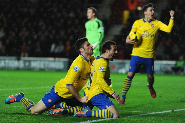 SOUTHAMPTON, ENGLAND - JANUARY 28:  Santi Cazorla of Arsenal celebrates with Olivier Giroud after scoring during the Barclays Premier League match between Southampton and Arsenal at St Mary's Stadium on January 28, 2014 in Southampton, England.  (Photo by Mike Hewitt/Getty Images)