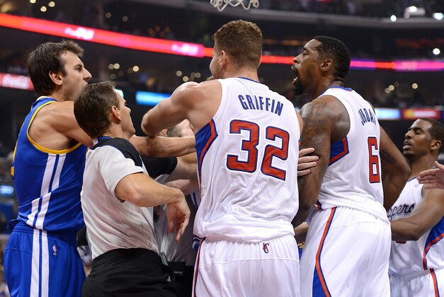 Oct 31, 2013; Los Angeles, CA, USA;   NBA referee Mark Ayotte (56) and Los Angeles Clippers power forward Blake Griffin (32) separate center DeAndre Jordan (6) after he was fouled by Golden State Warriors center Andrew Bogut (far left) in the second quarter of the game at Staples Center. Mandatory Credit: Jayne Kamin-Oncea-USA TODAY Sports