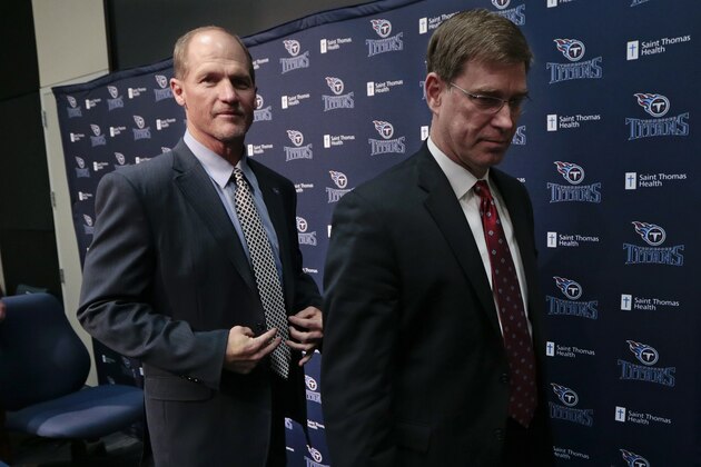 Tennessee Titans head coach Ken Whisenhunt, left, leaves a news conference with general manager Ruston Webster, right, Tuesday, Jan. 14, 2014, in Nashville, Tenn. The Titans introduced Whisenhunt Tuesday as their 17th head coach and only their third different coach since moving from Houston to Tennessee. (AP Photo/Mark Humphrey)