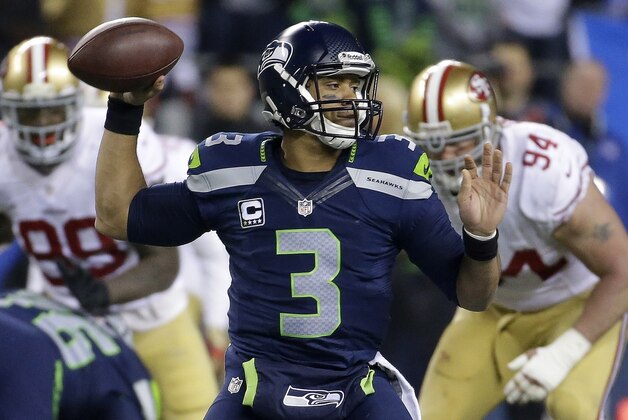 Seattle Seahawks' Russell Wilson throws during the second half of the NFL football NFC Championship game against the San Francisco 49ers, Sunday, Jan. 19, 2014, in Seattle. (AP Photo/Ted S. Warren)