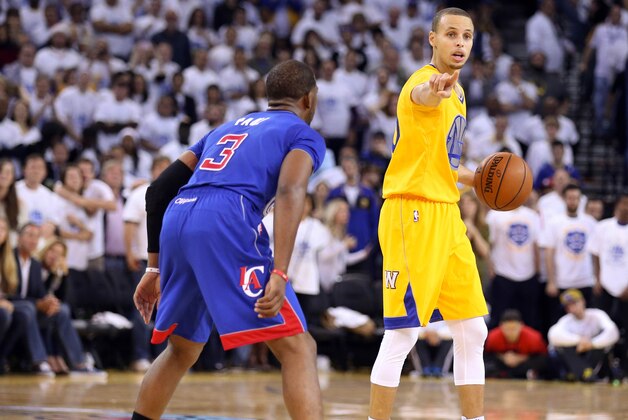 Dec 25, 2013; Oakland, CA, USA; Golden State Warriors point guard Stephen Curry (30) calls out to his teammates against Los Angeles Clippers point guard Chris Paul (3) during the fourth quarter at Oracle Arena. Mandatory Credit: Kelley L Cox-USA TODAY Sports
