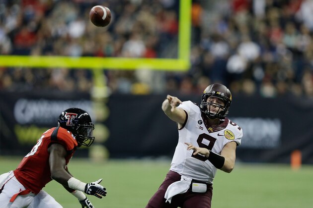 HOUSTON, TX - DECEMBER 28:  Phillip Nelson #9 of Minnesota looks to pass as he is pressured by Micah Awe #18 of Texas Tech during the Meineke Car Care of Texas Bowl at Reliant Stadium on December 28, 2012 in Houston, Texas.  (Photo by Scott Halleran/Getty Images)