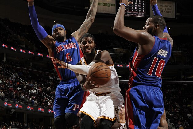 CLEVELAND, OH - OCTOBER 17:  Kyrie Irving #2 of the Cleveland Cavaliers passes the ball against Josh Smith #6 and Greg Monroe #10 of the Detroit Pistons at The Quicken Loans Arena on October 17, 2013 in Cleveland, Ohio. NOTE TO USER: User expressly acknowledges and agrees that, by downloading and/or using this Photograph, user is consenting to the terms and conditions of the Getty Images License Agreement. Mandatory Copyright Notice: Copyright 2013 NBAE (Photo by David Liam Kyle/NBAE via Getty Images)