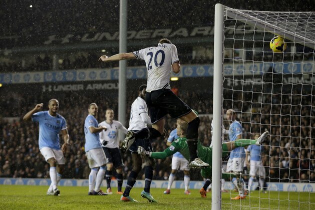 Tottenham Hotspur's Michael Dawson, 20, scores a goal that was judged to be offside and not given during the English Premier League soccer match between Tottenham Hotspur and Manchester City at White Hart Lane stadium in London, Wednesday, Jan. 29, 2014. (AP Photo/Matt Dunham) Tottenham Hotspur's Michael Dawson, 20, scores a goal that was judged to be offside and not given during the English Premier League soccer match between Tottenham Hotspur and Manchester City at White Hart Lane stadium in London, Wednesday, Jan. 29, 2014. (AP Photo/Matt Dunham)