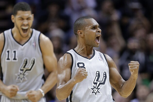 San Antonio Spurs' Patty Mills (8), of Australia, and Jeff Ayres celebrate after Mills hit a 3-point shot against the Memphis Grizzlies during the first half ofn an NBA basketball game, Wednesday, Oct. 30, 2013, in San Antonio. (AP Photo/Eric Gay)
