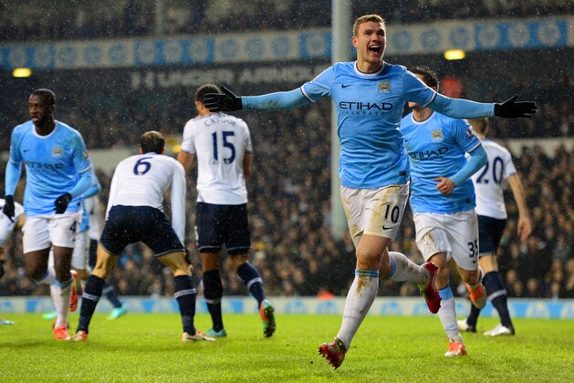 LONDON, ENGLAND - JANUARY 29: Edin Dzeko of Manchester City celebrates scoroing their third goal during the Barclays Premier League match between Tottenham Hotspur and Manchester City at White Hart Lane on January 29, 2014 in London, England.  (Photo by Jamie McDonald/Getty Images)
