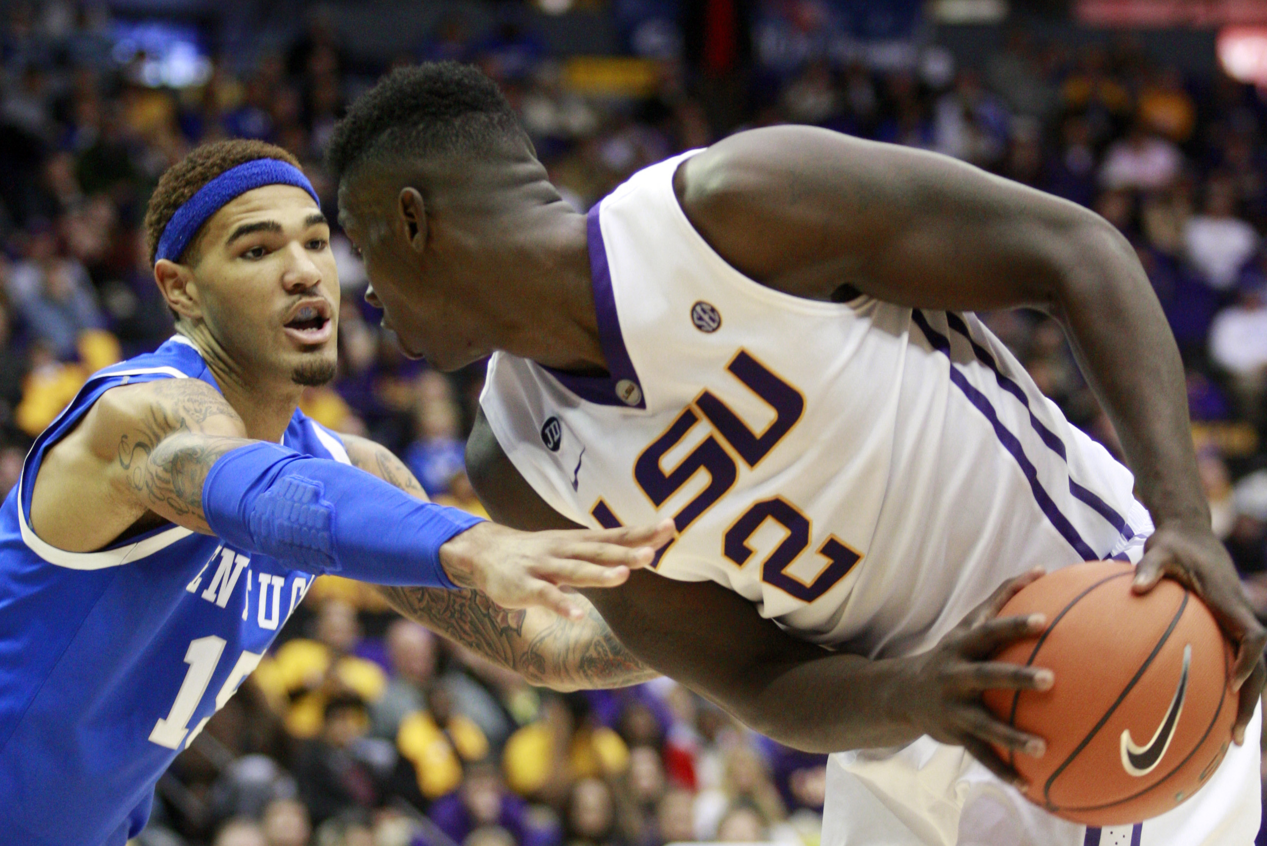 Kentucky forward Willie Cauley-Stein (15) defends LSU forward Johnny O'Bryant III (2) in the second half of an NCAA college basketball game in Baton Rouge, La., Tuesday, Jan. 28, 2014. LSU won 87-82. (AP Photo/Tim Mueller)